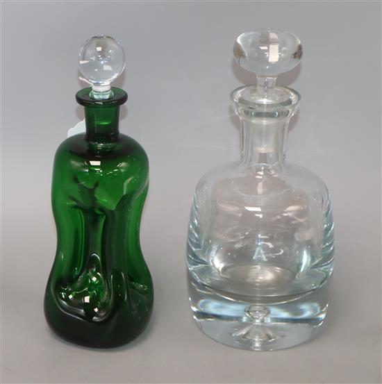 A Holmegaard green glass decanter and stopper and a Scandinavian style heavy glass decanter and stopper